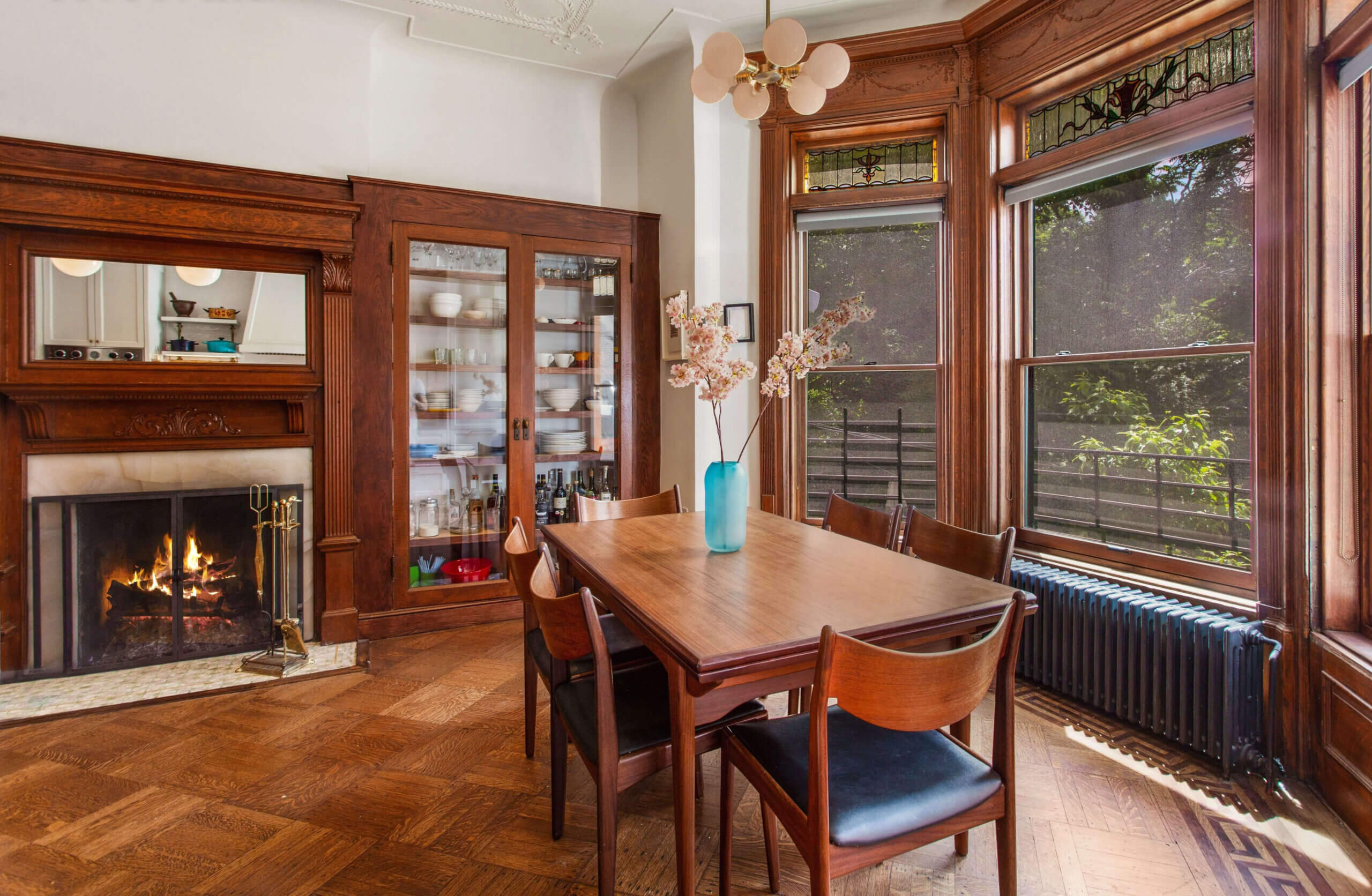 dinging room with mantel and built-ins