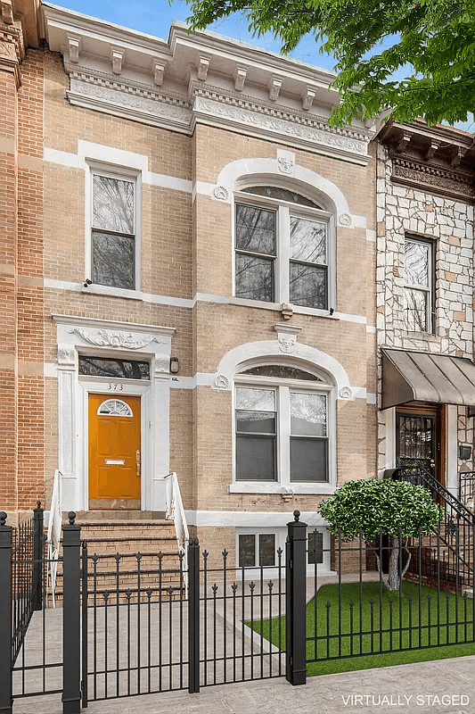 pale brick exterior of the row house