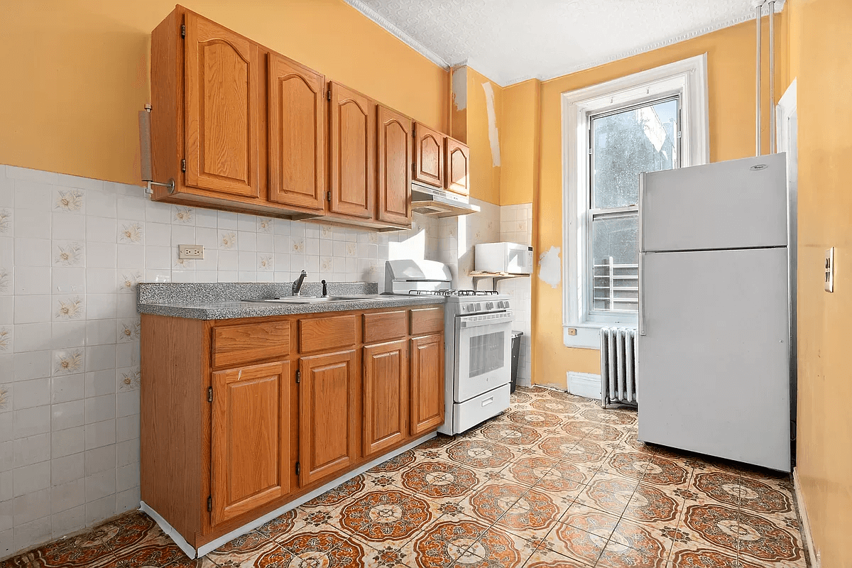 kitchen with wood cabinets and bright tile floor