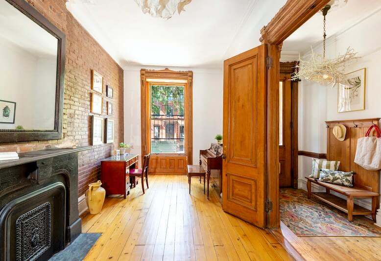parlor with exposed brick wall