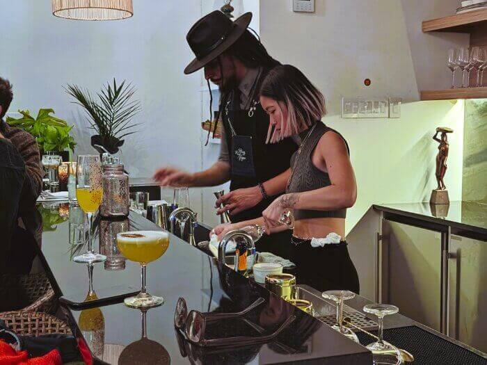 bartenders at work behind the bar