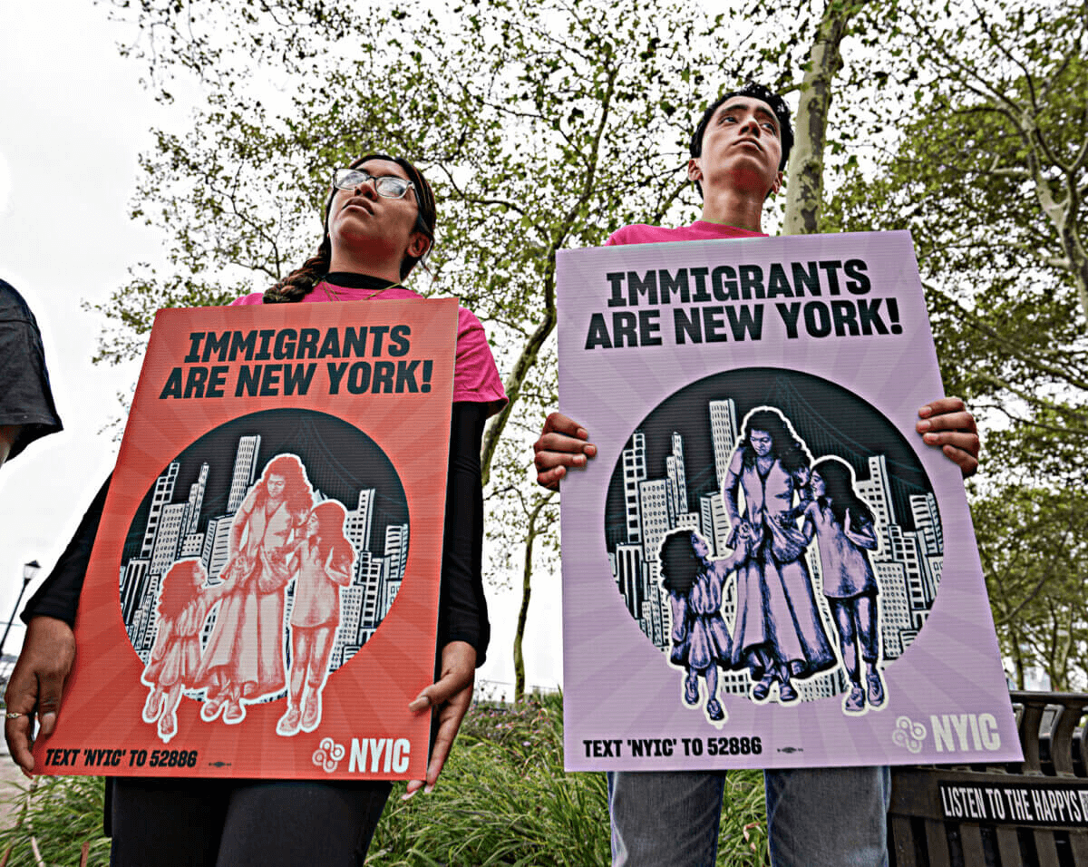 people holding protest signs