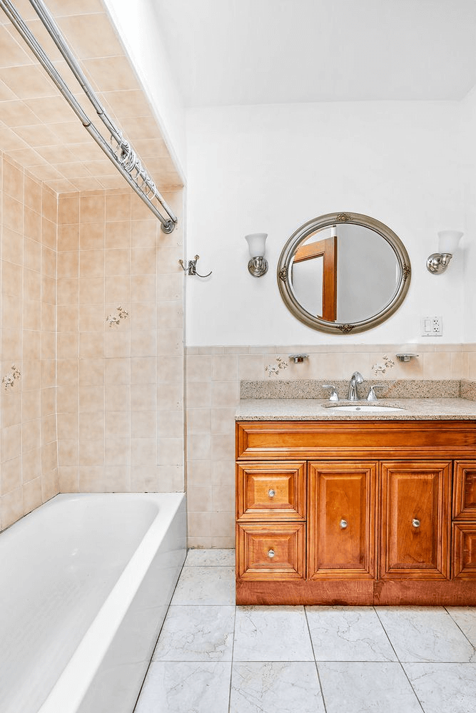 bathroom with wood vanity
