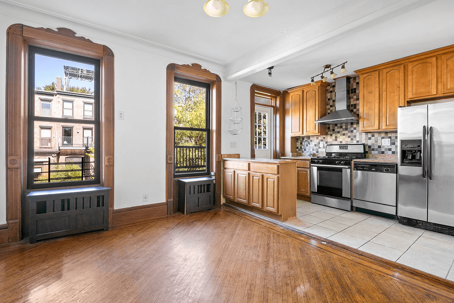 dining room and open plan kitchen with stainless steel appliances