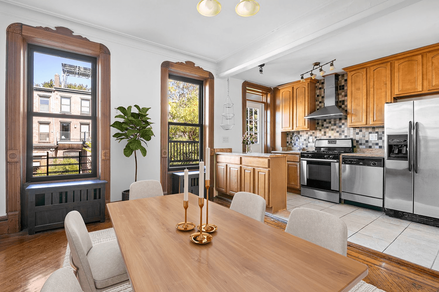 virtually staged dining room with open kitchen