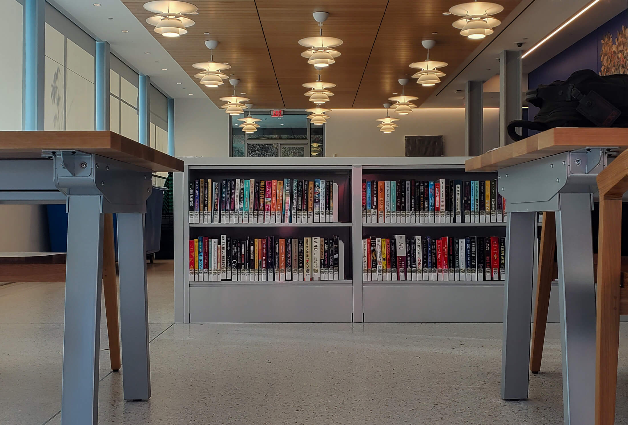 glimpse of the interior showing tables and bookshelves