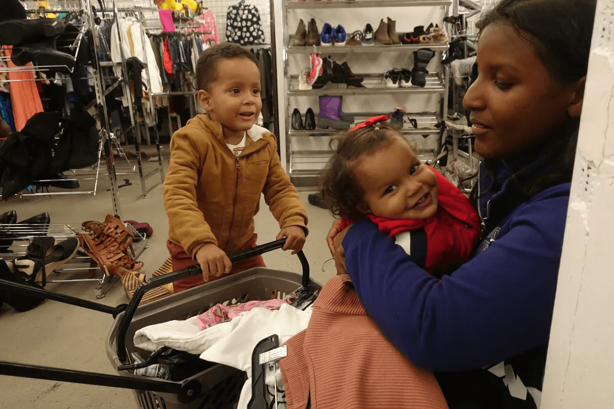 migrant family shopping for clothes