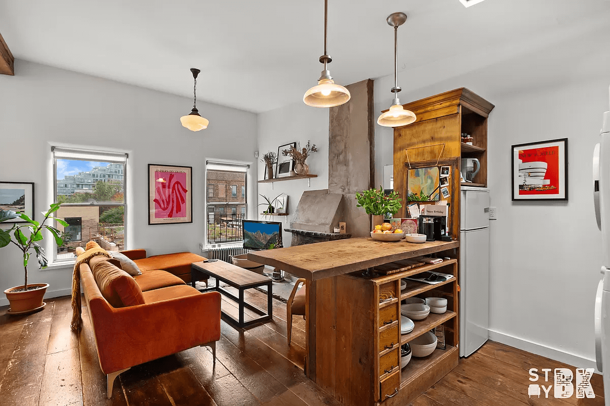 williamsburg - open living room and kitchen with wide plank floor boards