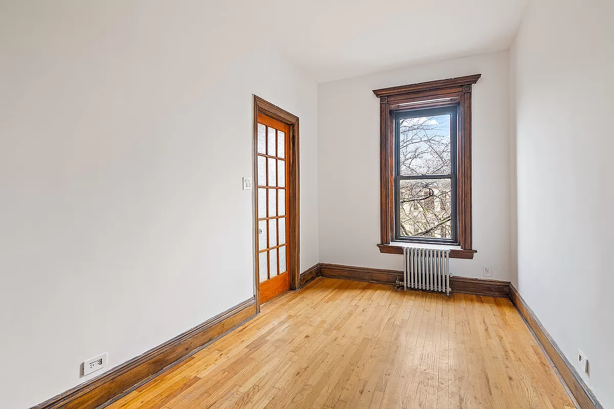 narrow bedroom with window