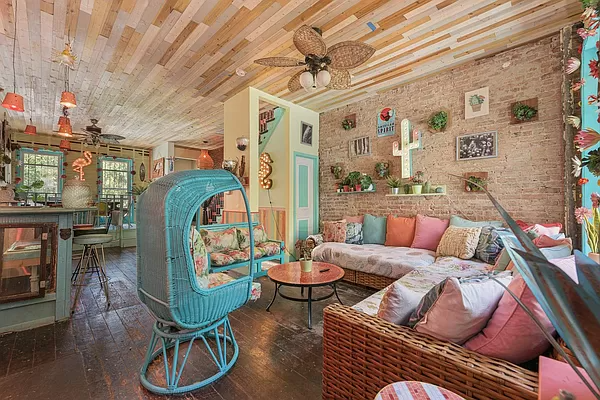 bed stuy interior with wood paneled ceiling