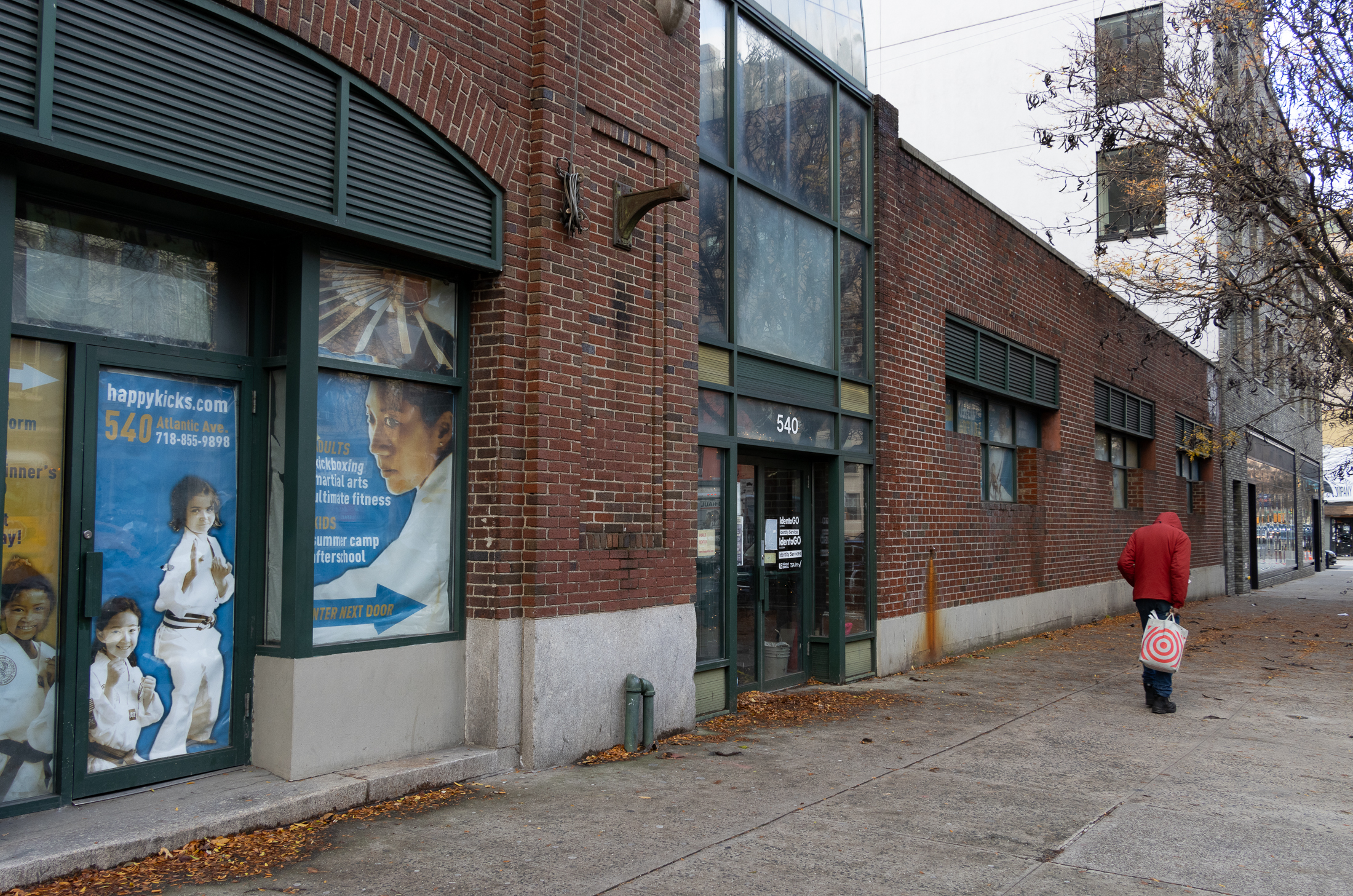 streetlevel view of the entrances to the brick buidling