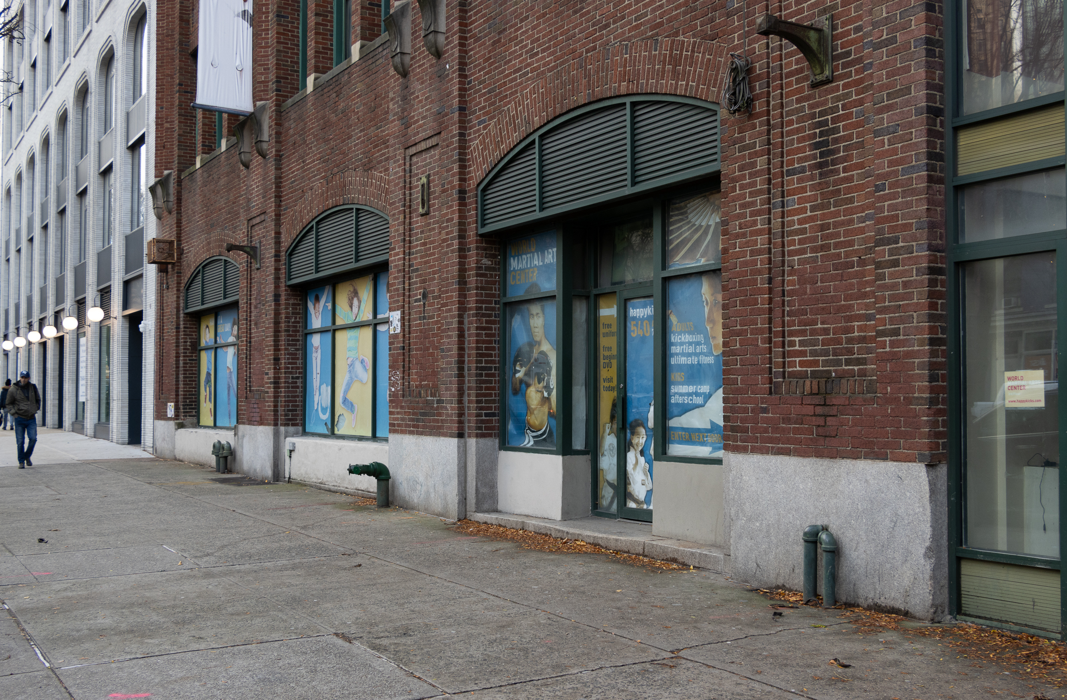 streetlevel view of the entrances to the brick buidling