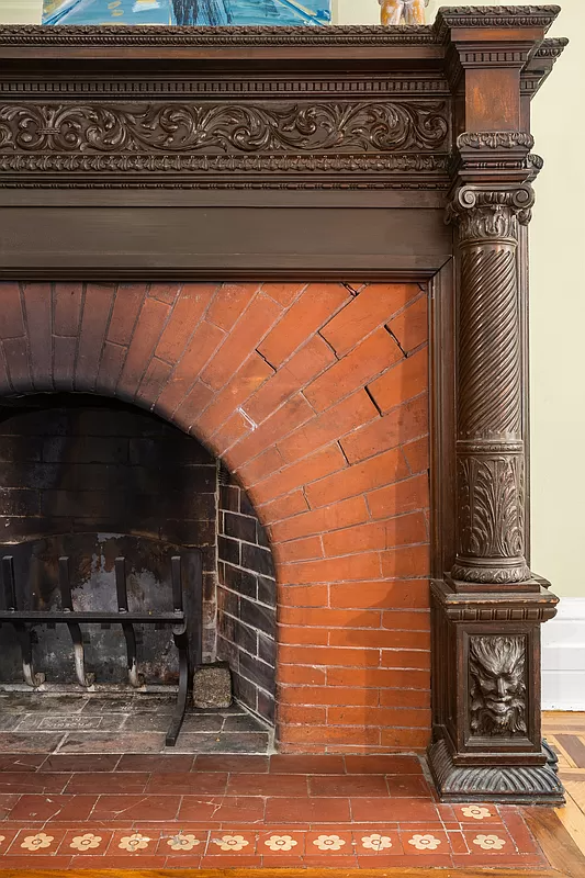 wood mantel with brick