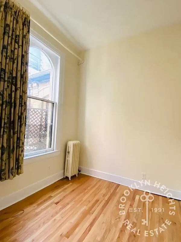 bedroom with wood floor