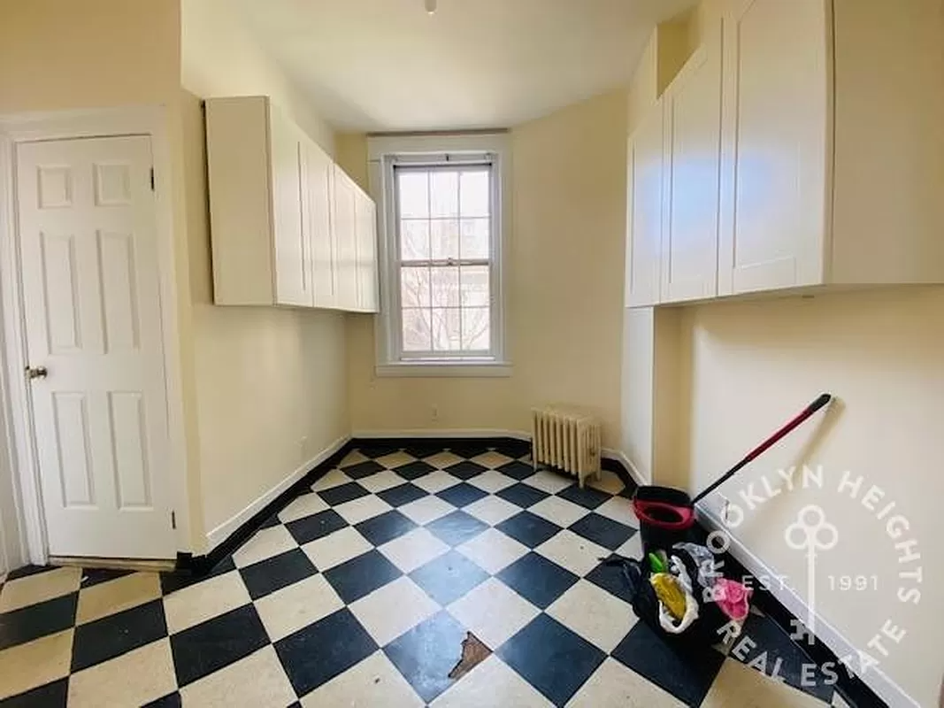 dining area with with black and white checkerboard floor tiles