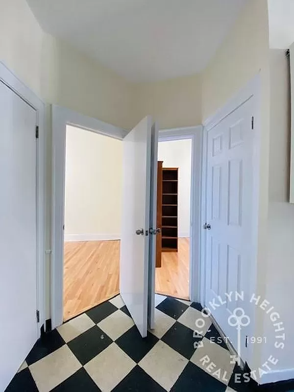 kitchen with two doors to bedrooms