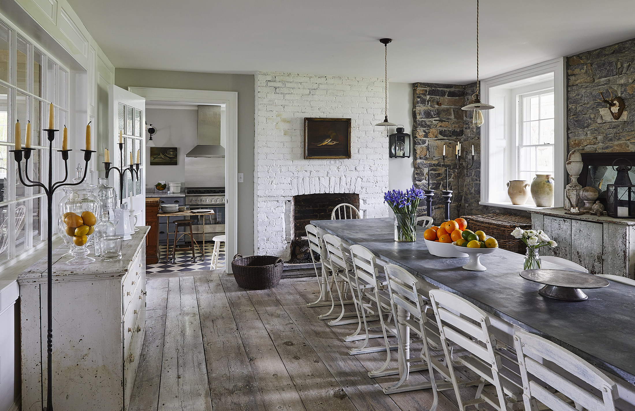 old house books - dining room interior with wide plank floorboards and a fireplace