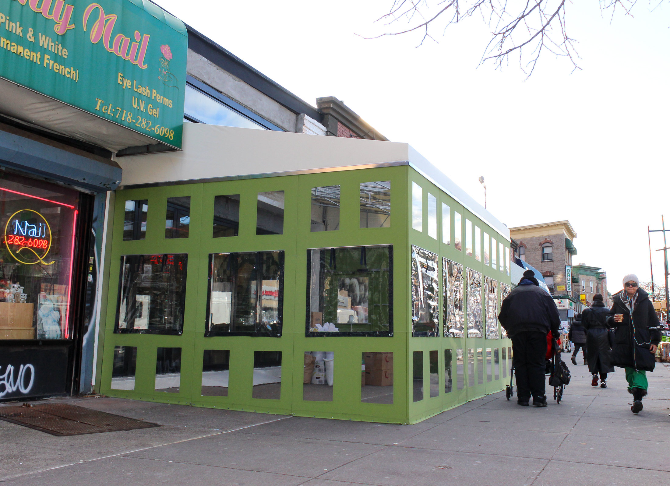 people walking by the new restaurant