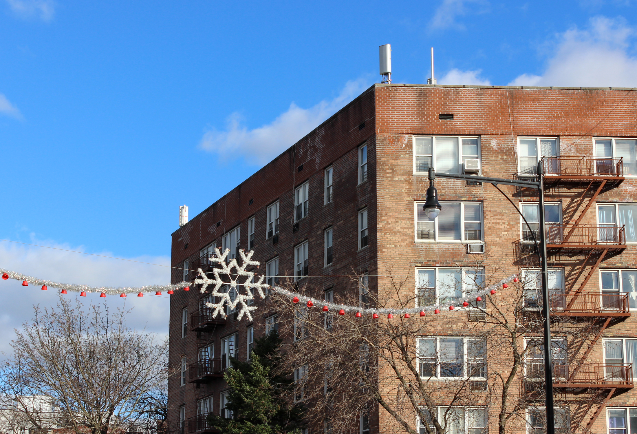 brooklyn - snowflake street decoration in front of an apartment building