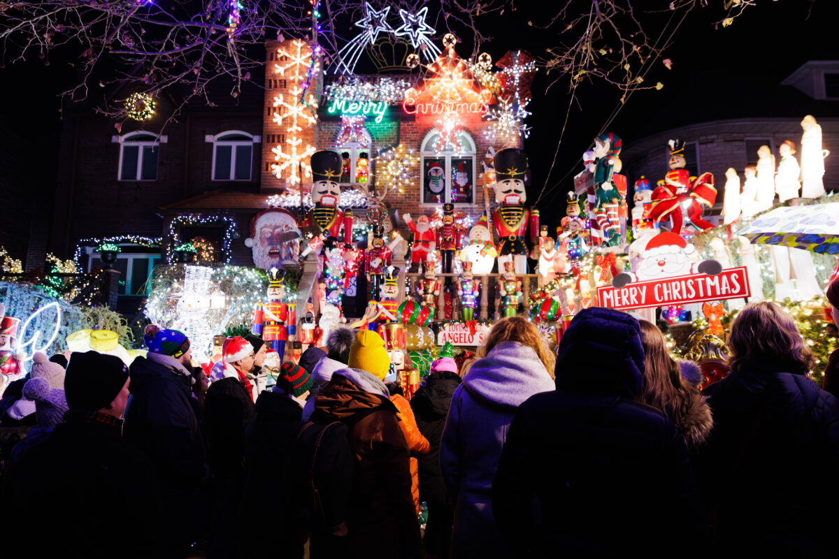 people crowded in front of a house