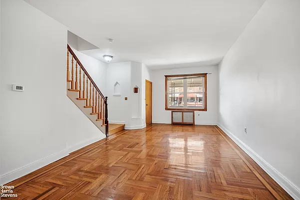 living room with wood floor, niche in wall