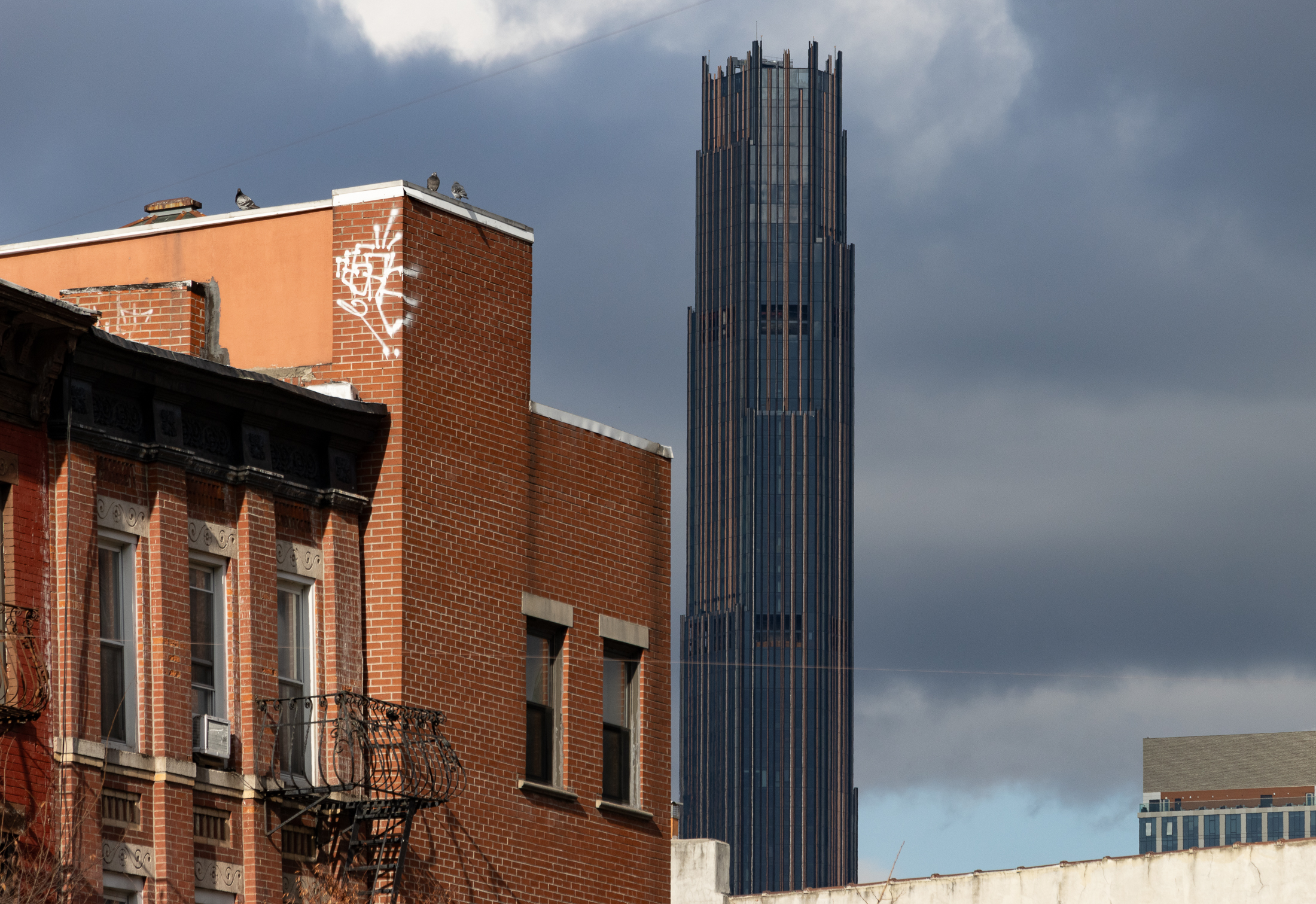 brooklyn - view of brick buildings with modern tower in the background