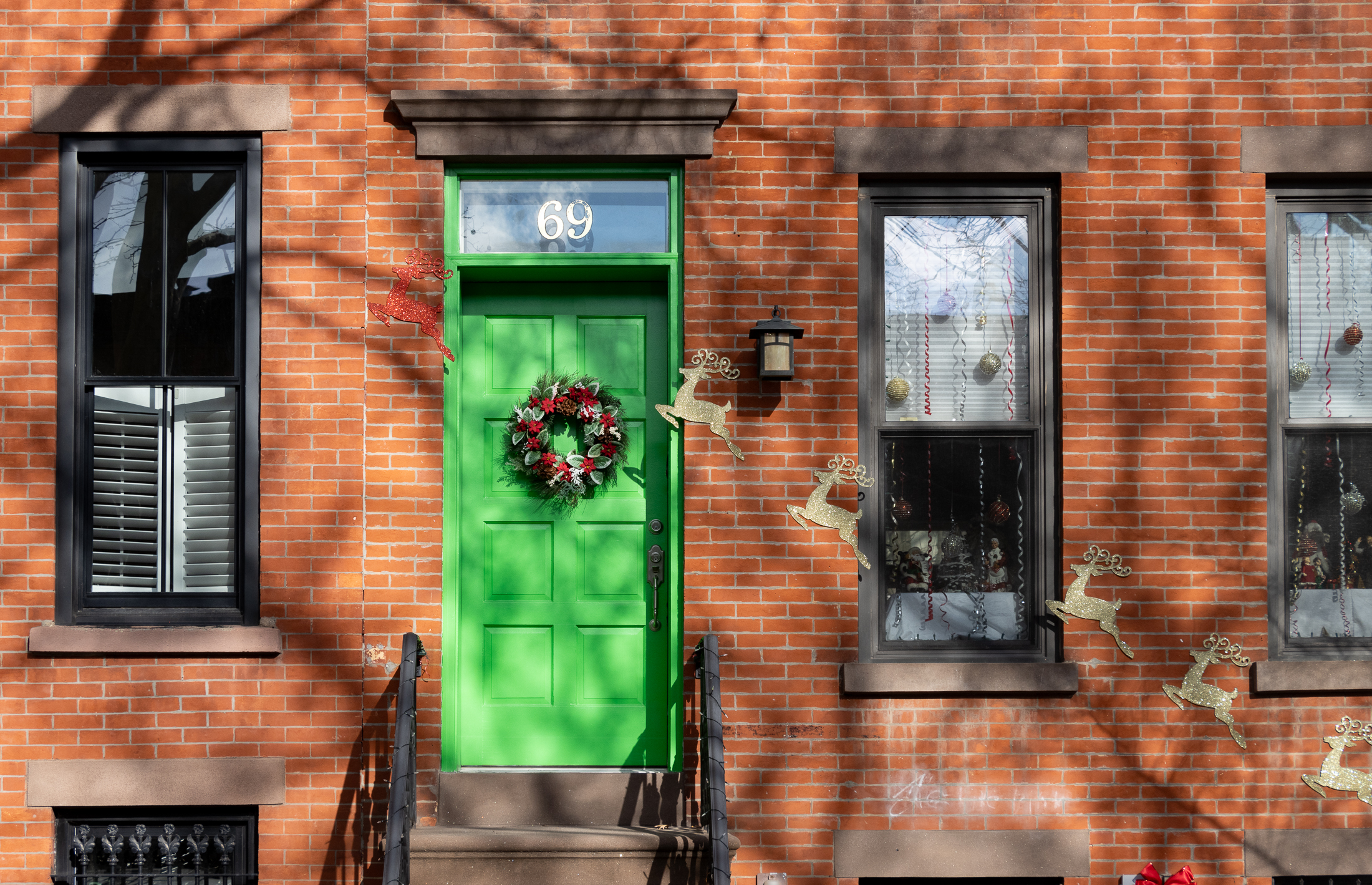 brooklyn - green front door with a holiday wreath