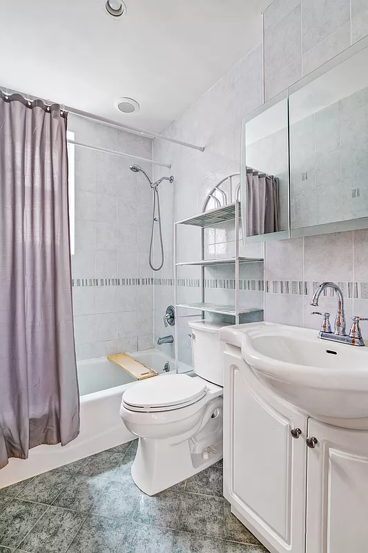 bathroom with green floor tile and a green border tile