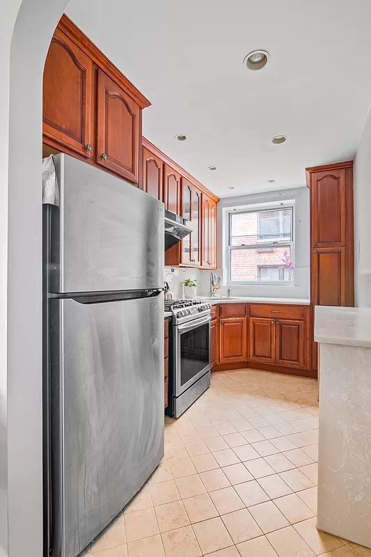 kitchen with wood cabinets and beige floor tile