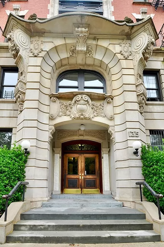 beaux-arts entry of the building with stone ornament