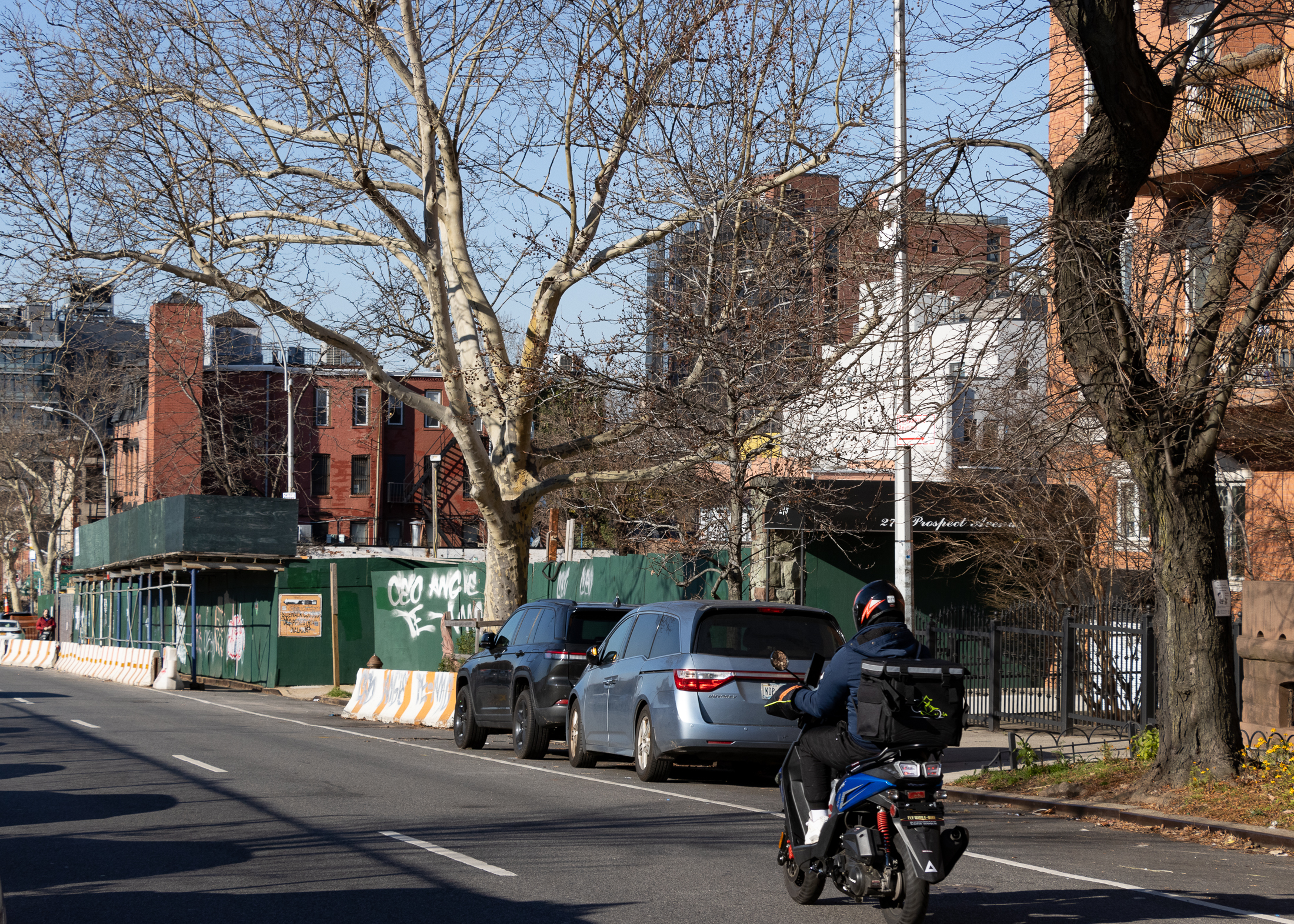 view on prospect avenue of construction fence and shed