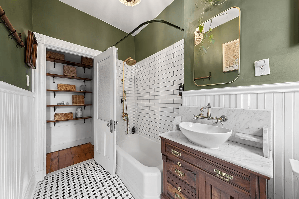 bathroom with white subway tile around tub and white beadboard on other walls