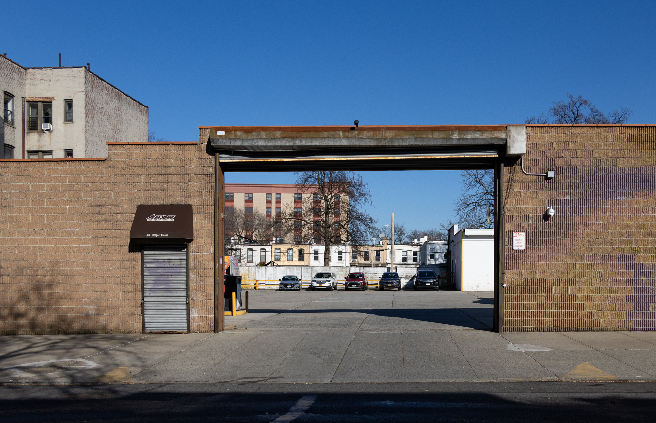 view into the parking lot at arrow linen