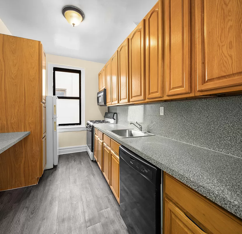 kitchen with wood cabinets and gray vinyl floor