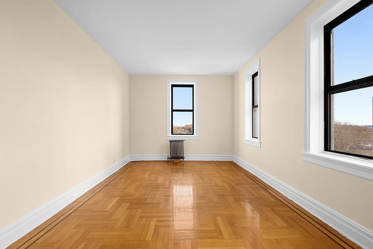 living room with two exposures and radiator under one window