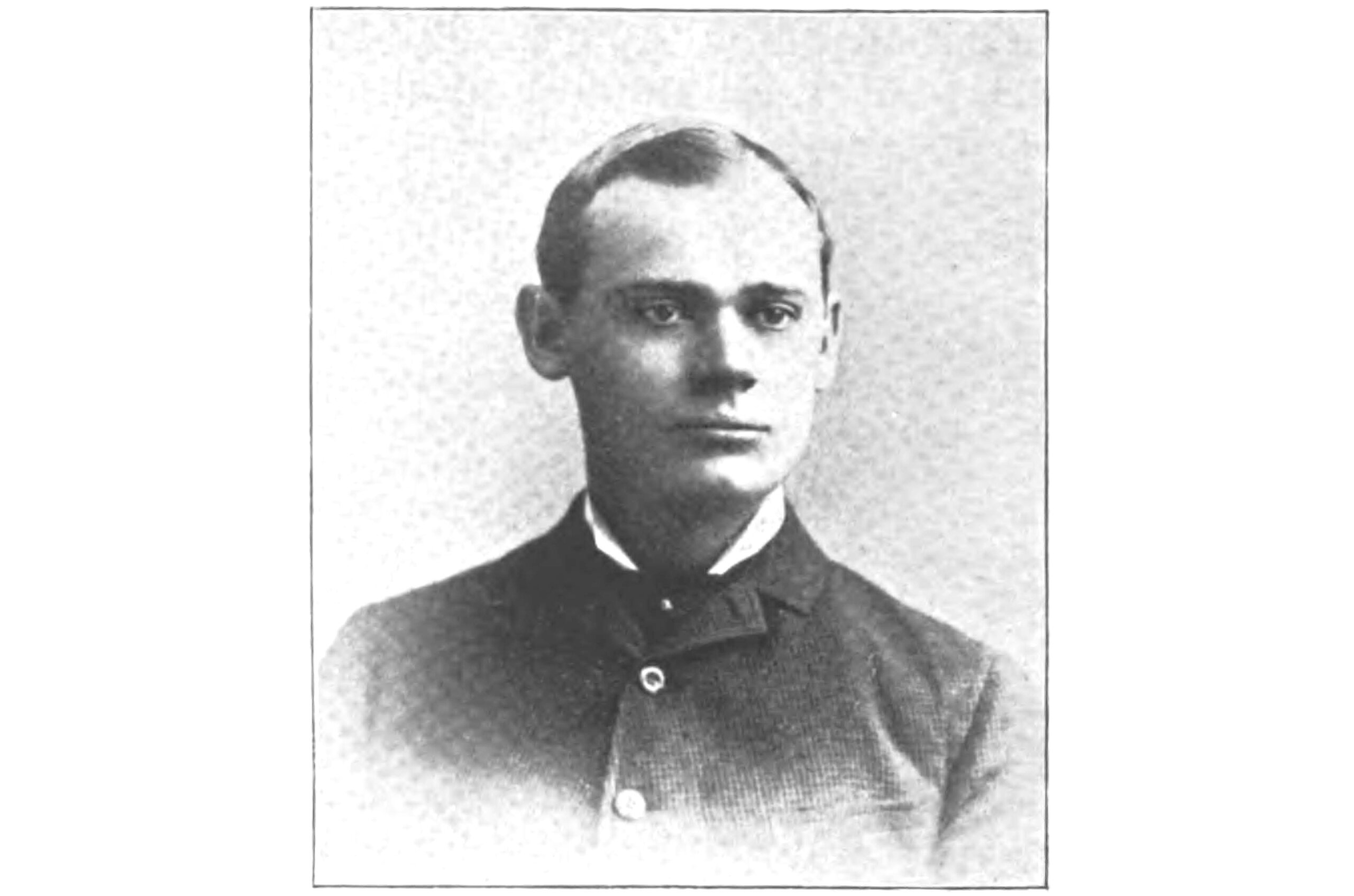 black and white portrait of john pope in a suit