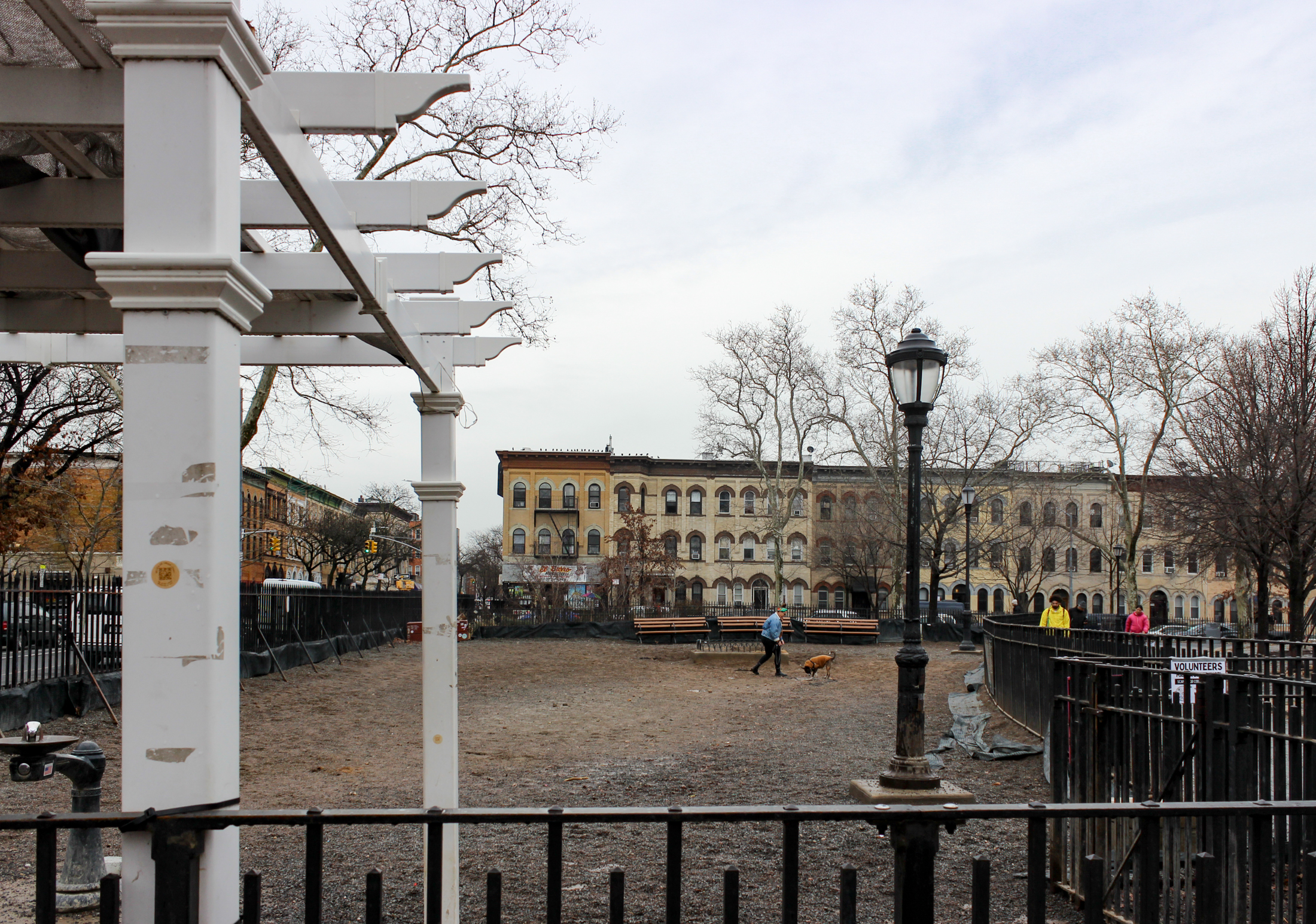 view into fenced-in dog park with benches