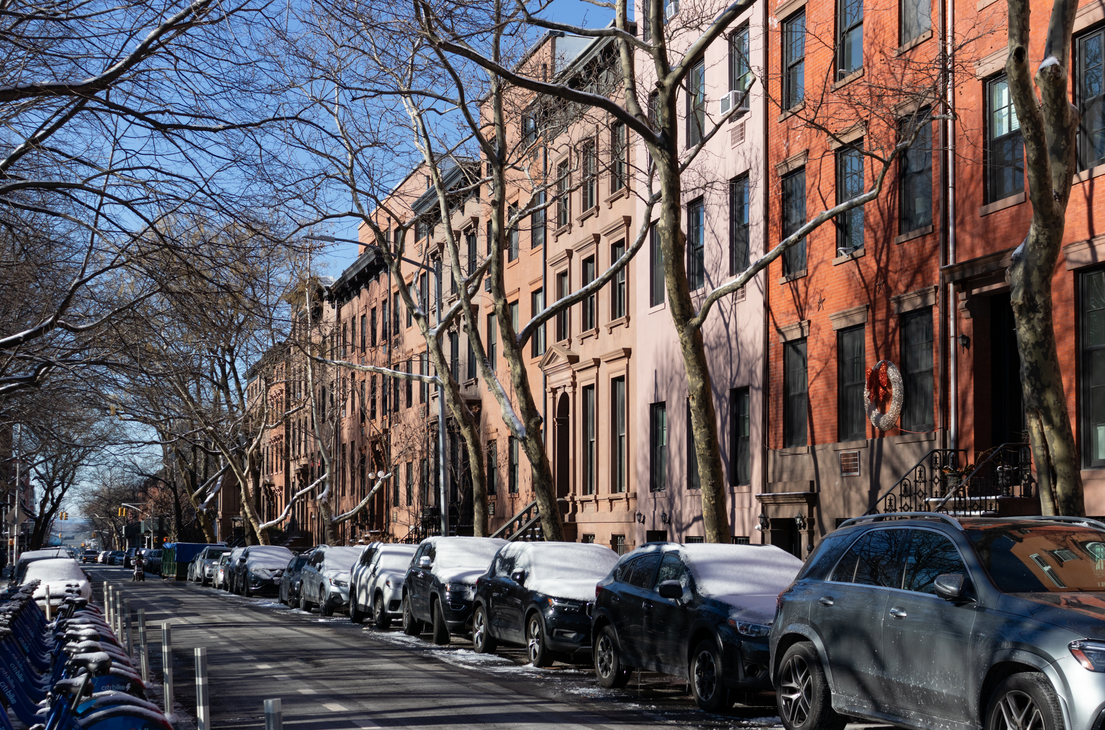 brooklyn - view on congress street with snow covered cars parked in front of row houses