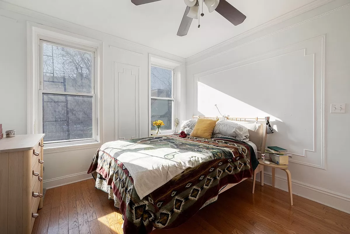 bedroom with wall moldings