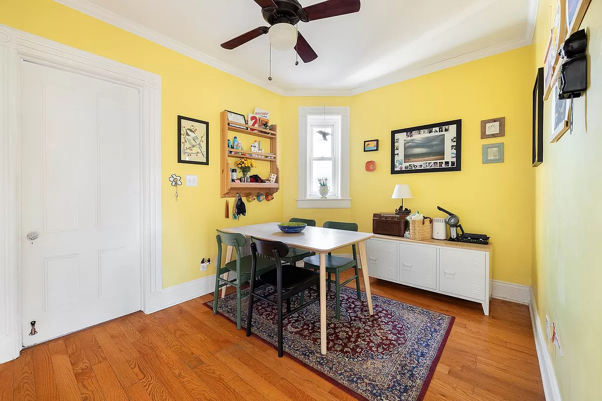 dining room with small window and wood floor