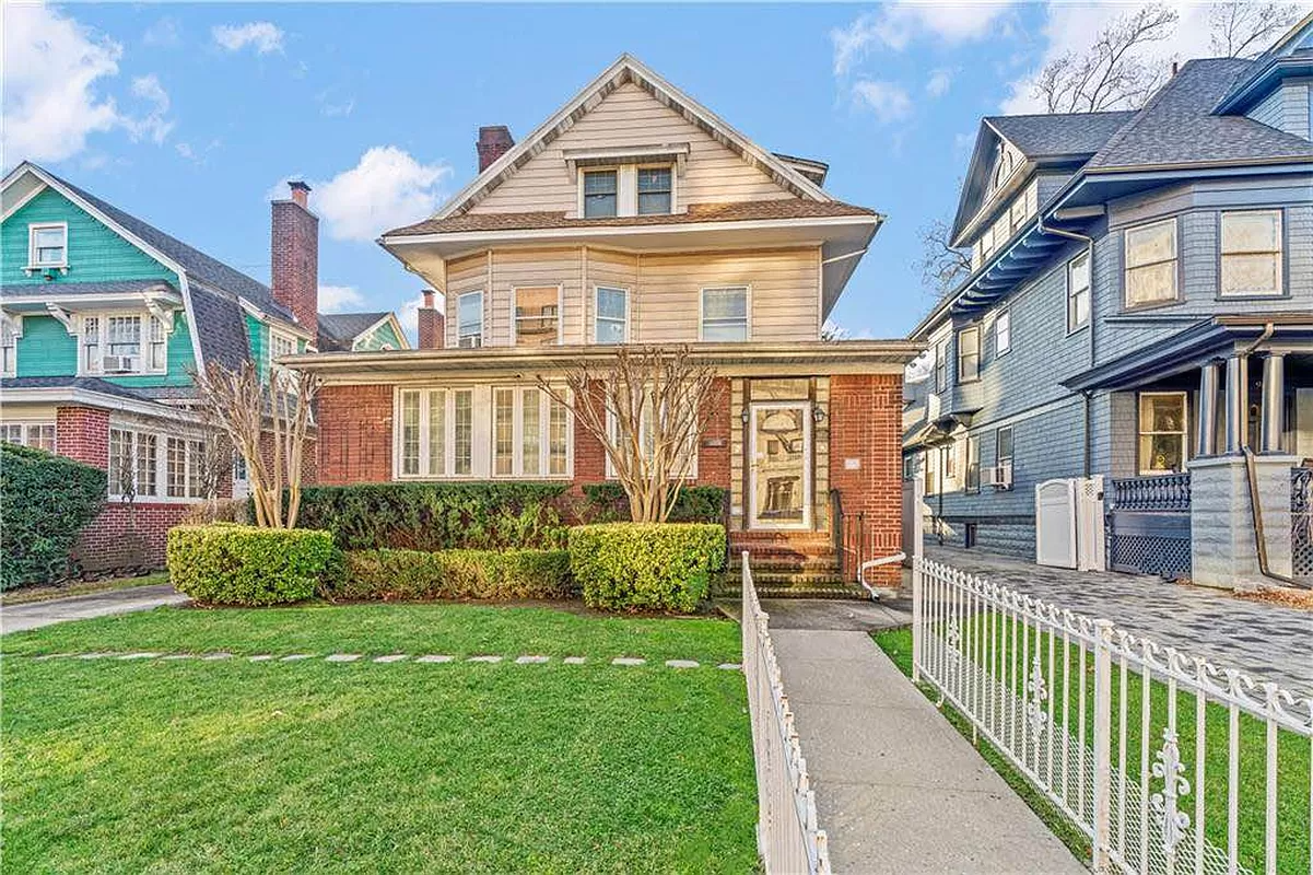 ditmas park - standalone house with siding and a brick enclosed porch
