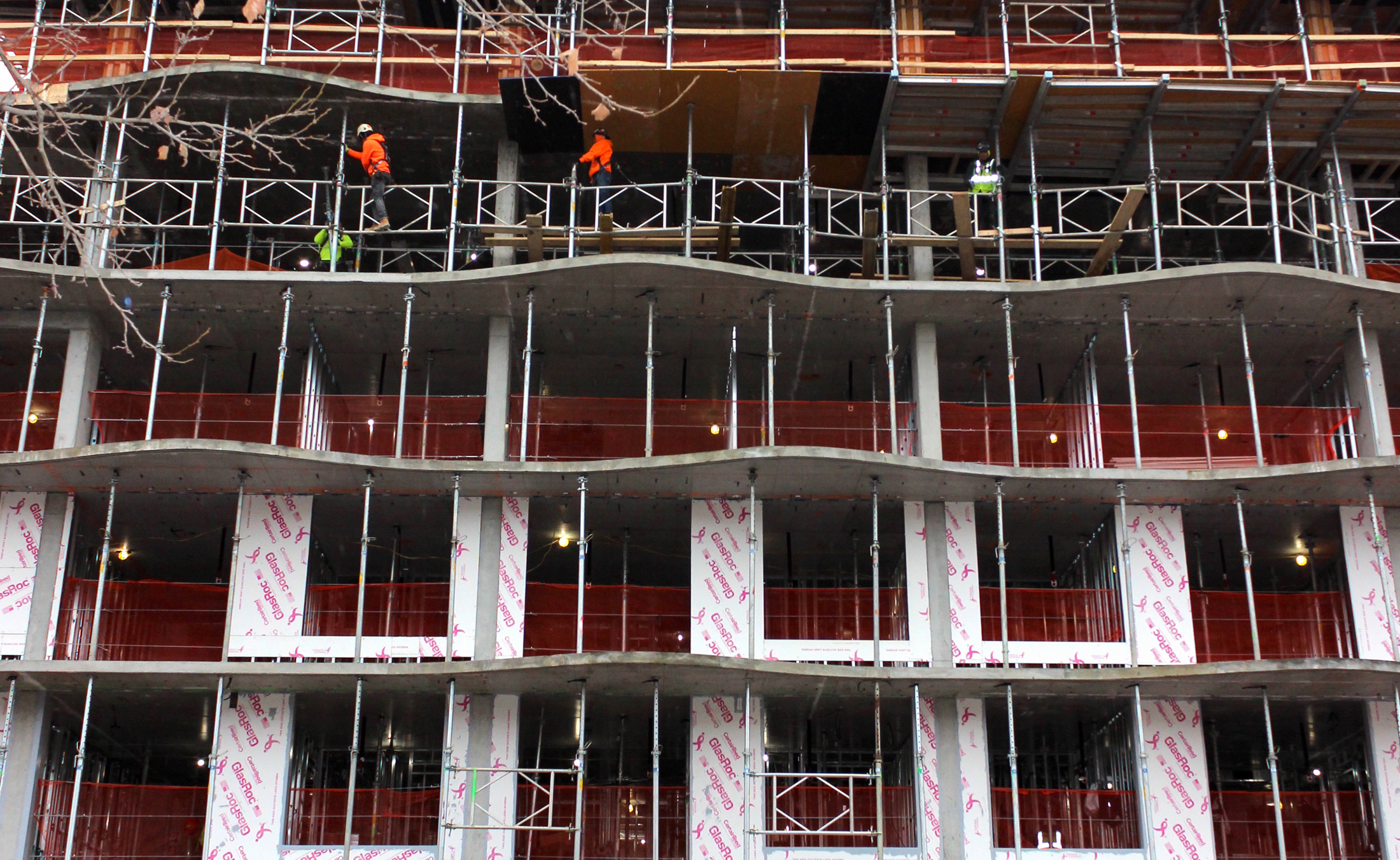 construction workers working on the building