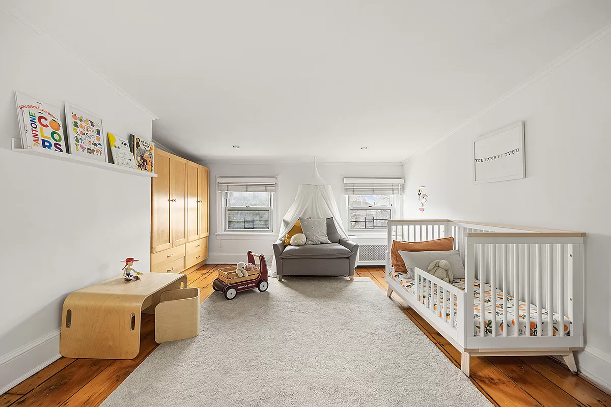 top floor bedroom with wide floorboards