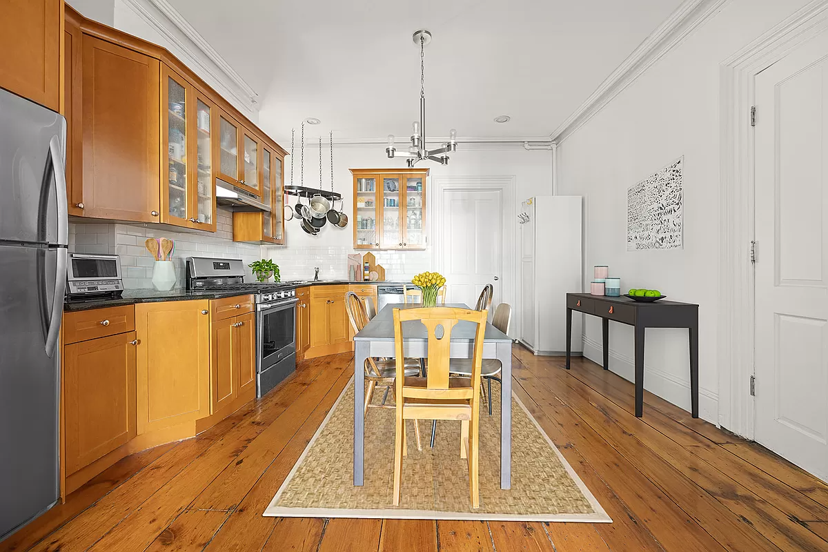 kitchen with wood cabinets and wood floor