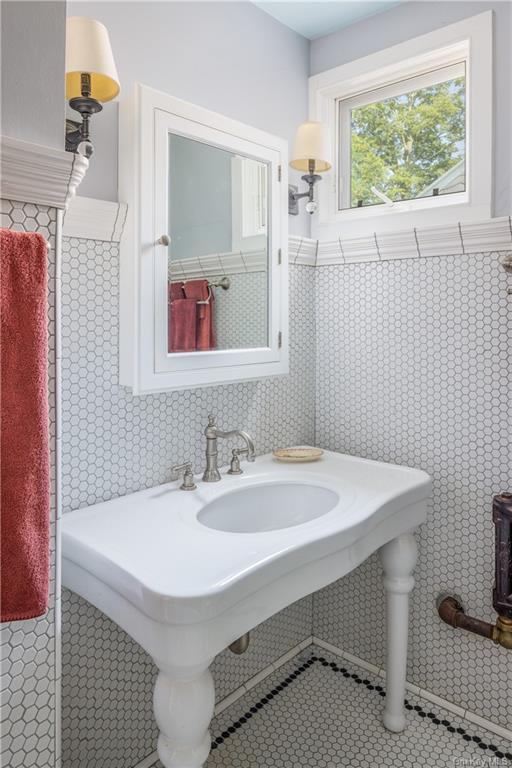 bathroom with a white console sink
