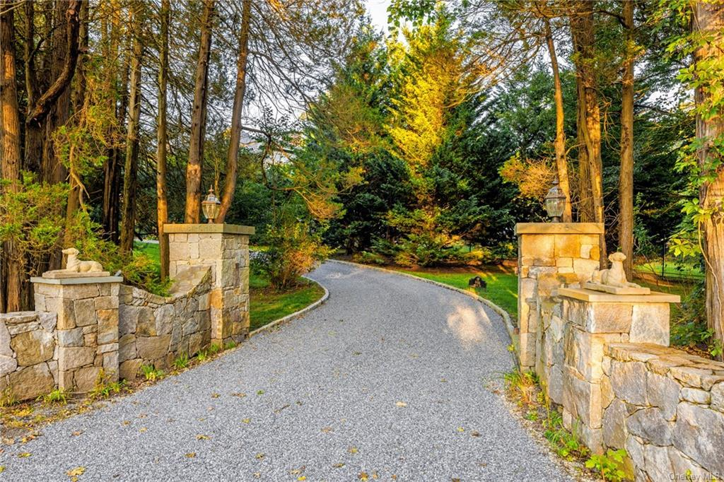 entrance to driveway flanked by stone walls