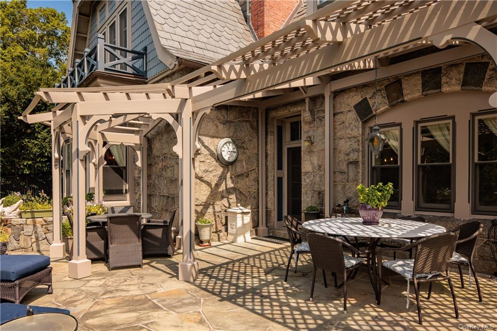 patio with pergola and room for multiple tables