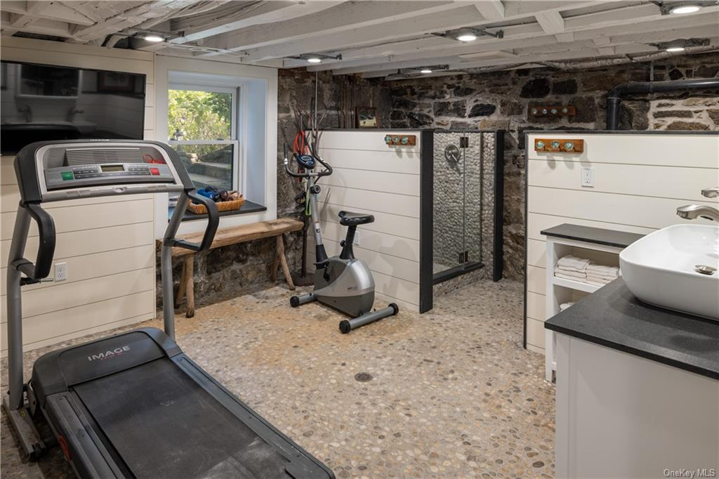 gym in basement with river stone floor