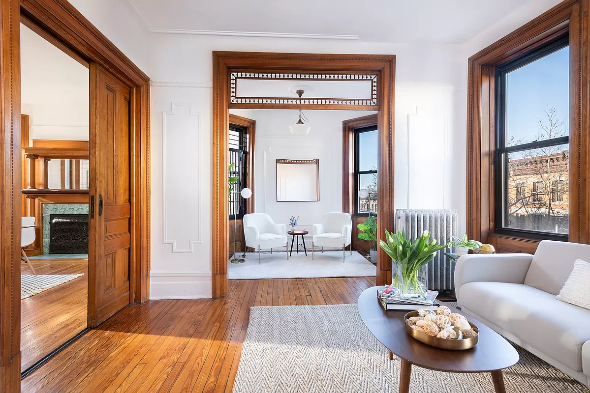 park slope -living room with view into nook with wood floor and moldings