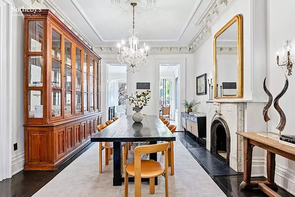 dining room with plaster details and a marble mantel